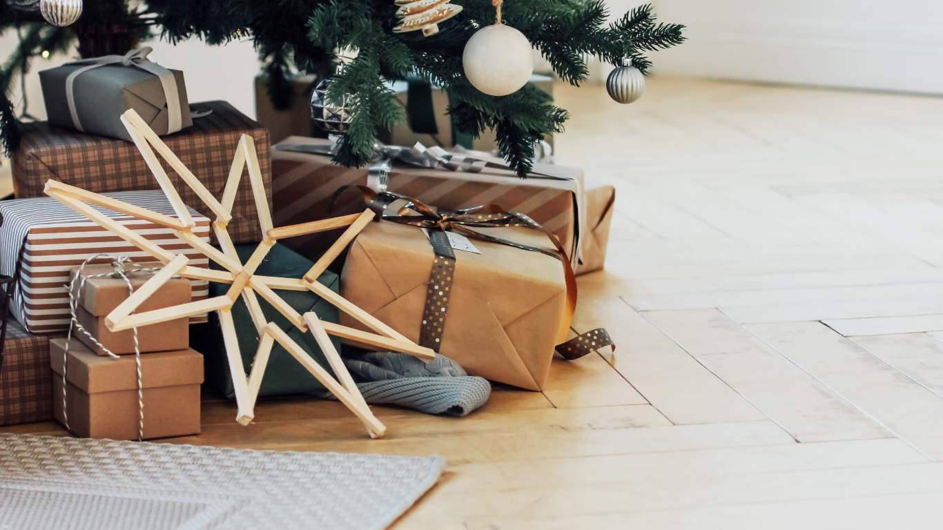 Gifts wrapped up next to a wooden star