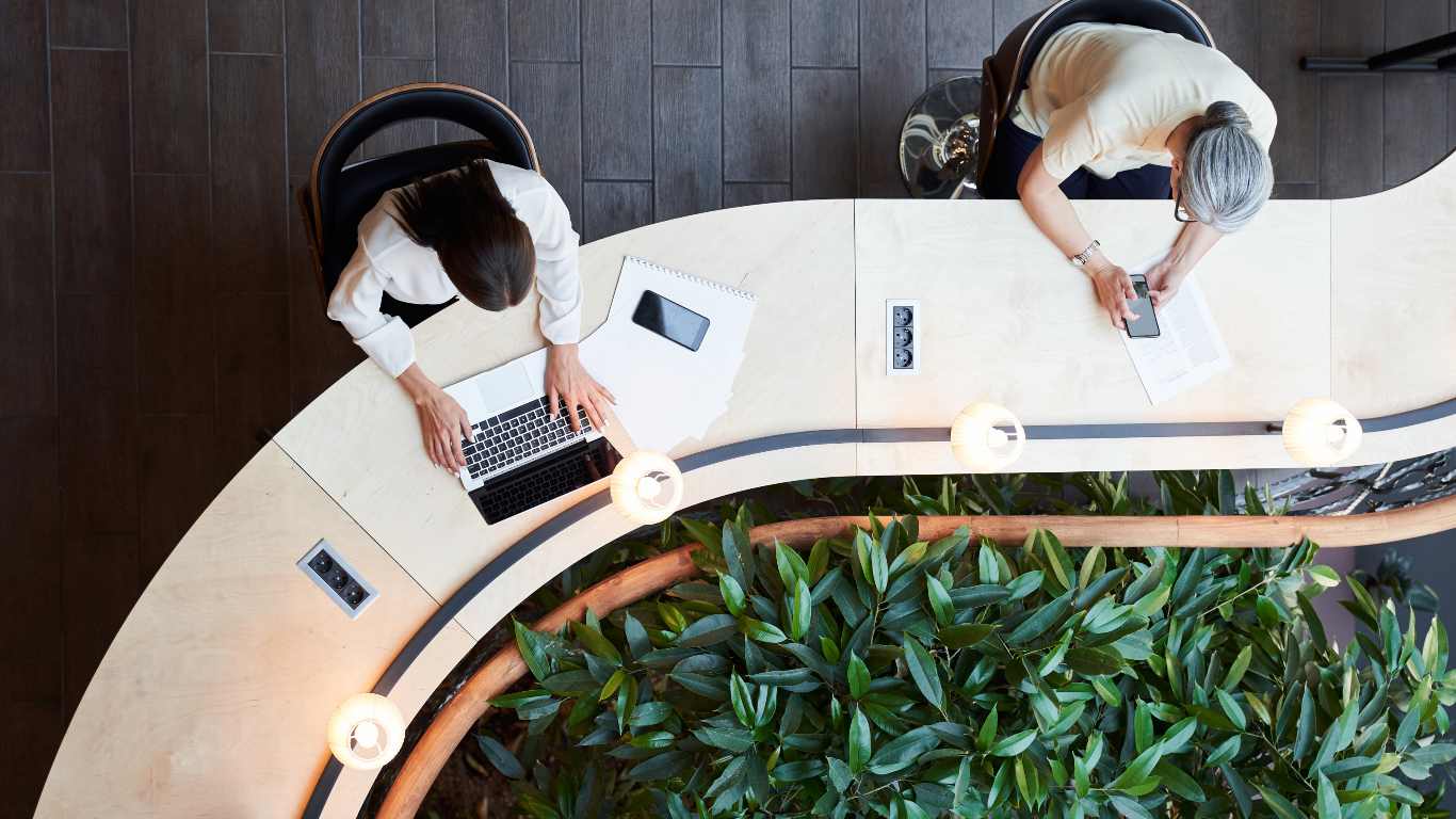 People working at an open plan office